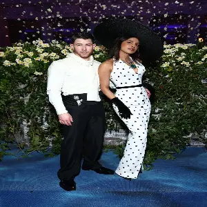 Priyanka Chopra and Nick Jonas at Met Gala 2025, twinning in elegant white ensembles, exuding fairytale vibes on the red carpet.
